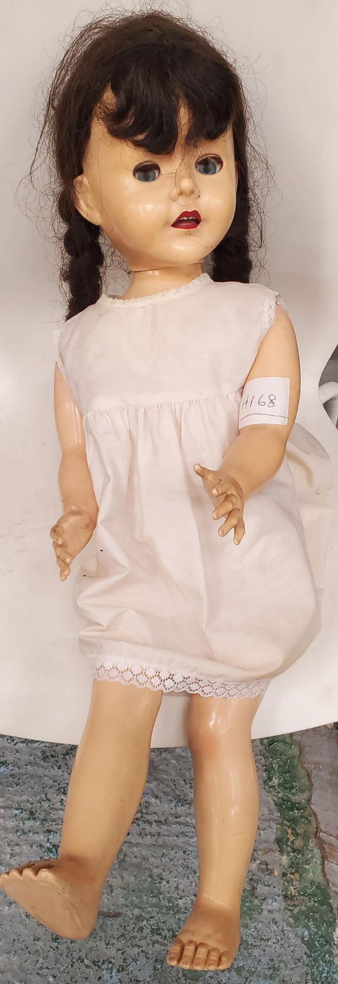 A VINTAGE HARD PLASTIC PEDIGREE DOLL WITH SLEEPY EYES, ROSEBUD LIPS AND ARTICULATED JOINTS, HEIGHT