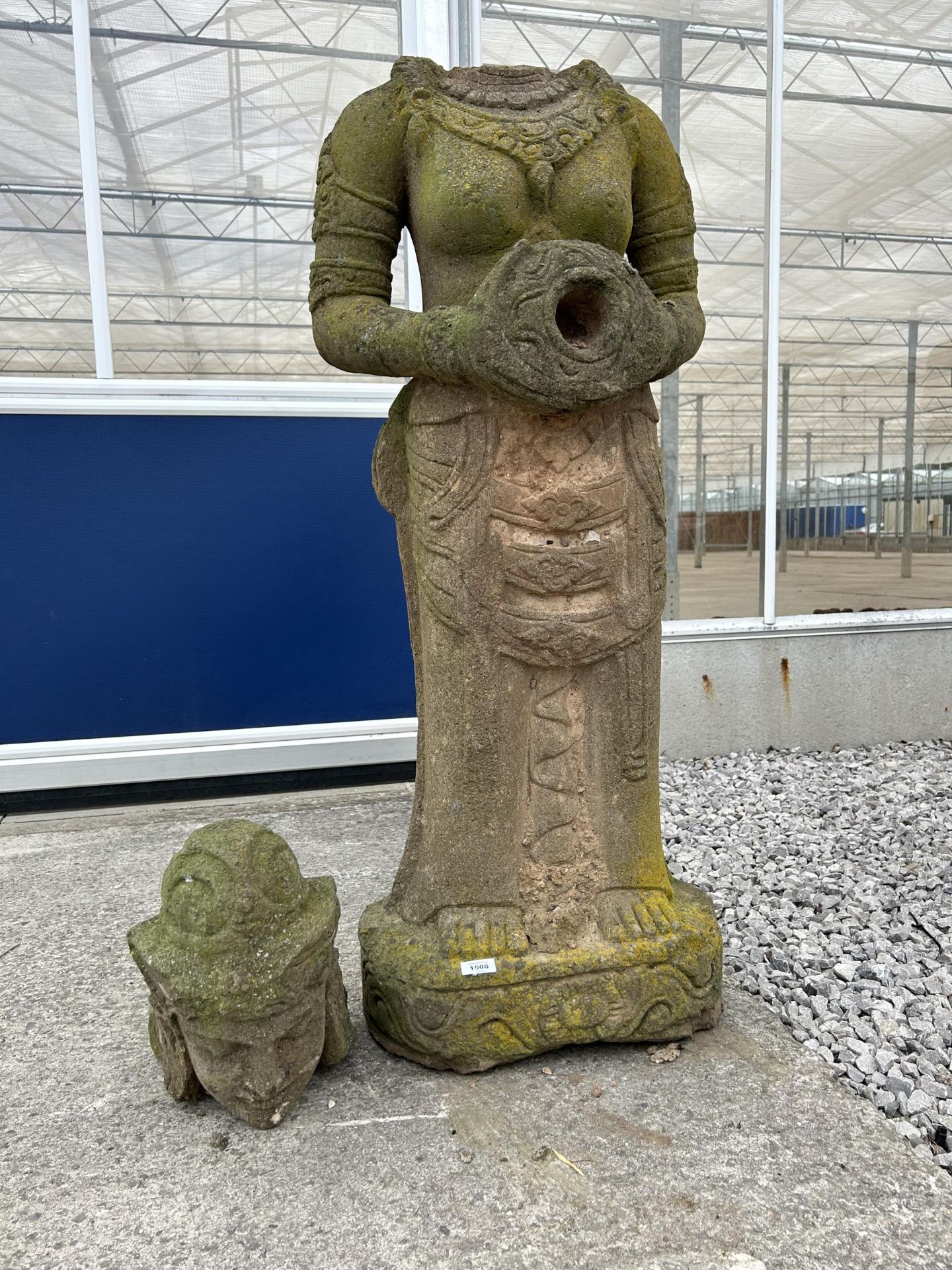 A LARGE RECONSTITUTED STONE BUDDHIST DIETY FIGURE A/F - HEIGHT (WITHOUT HEAD) 110 CM, DEPTH 28 CM