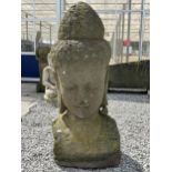A LARGE RECONSTITUTED STONE BUDDHIST DIETY FIGURE - HEIGHT 150 CM, DEPTH 50 CM (SLIGHT A/F TO EAR