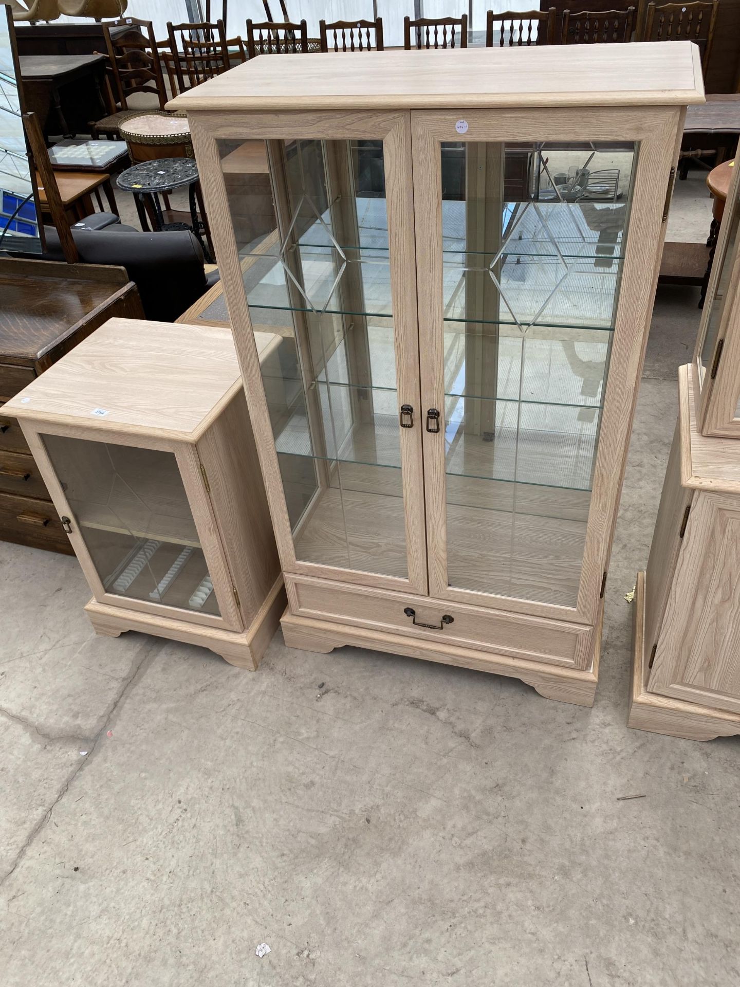 A MODERN MORRIS FURNITURE CO. GLAZED CHINA CABINET AND STEREO CABINET