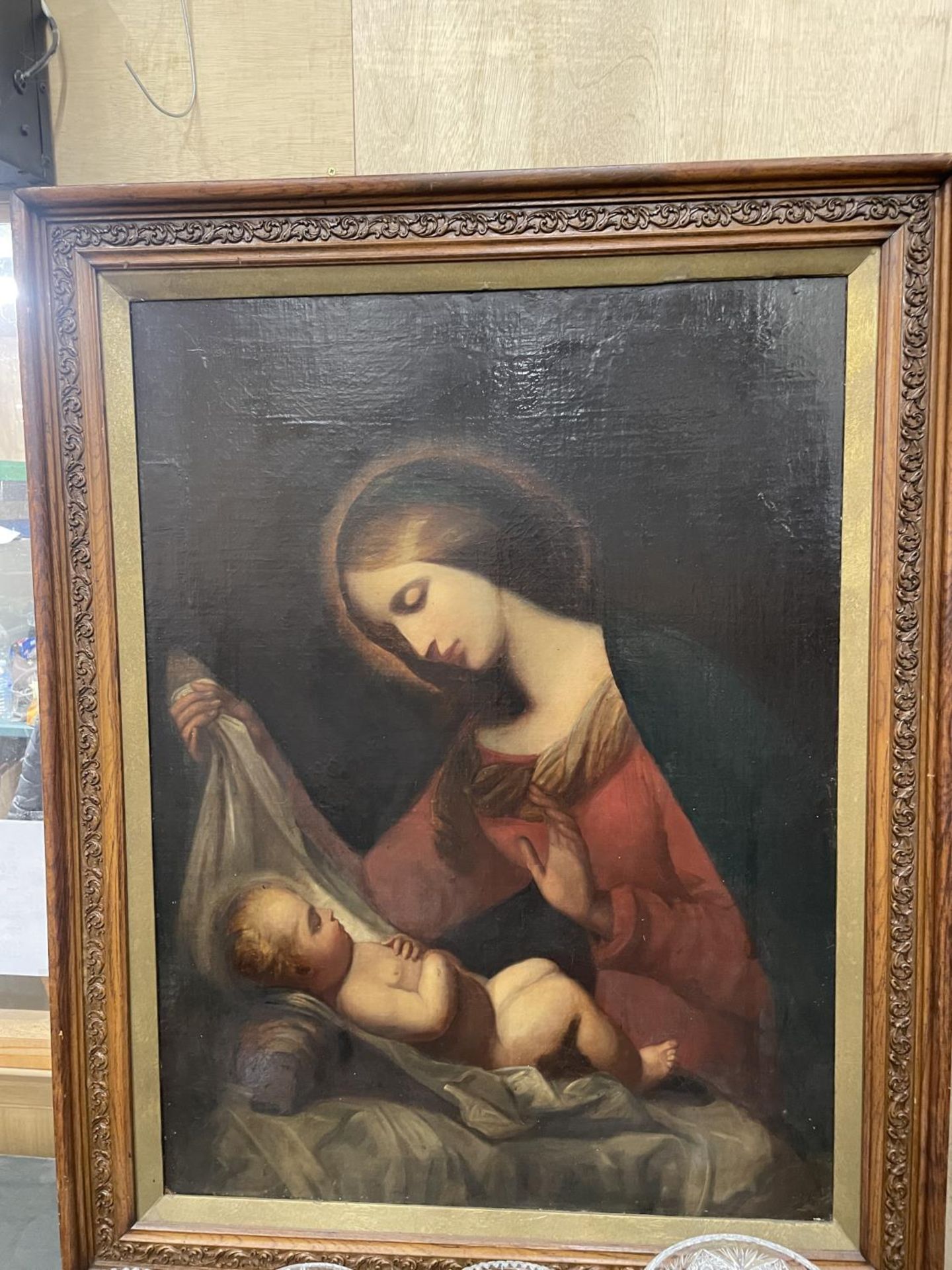 A 19TH CENTURY PAINTING OF THE MADONNA AND CHILD, OIL ON BOARD, 97CM X 72CM, FRAMED TOGETHER WITH