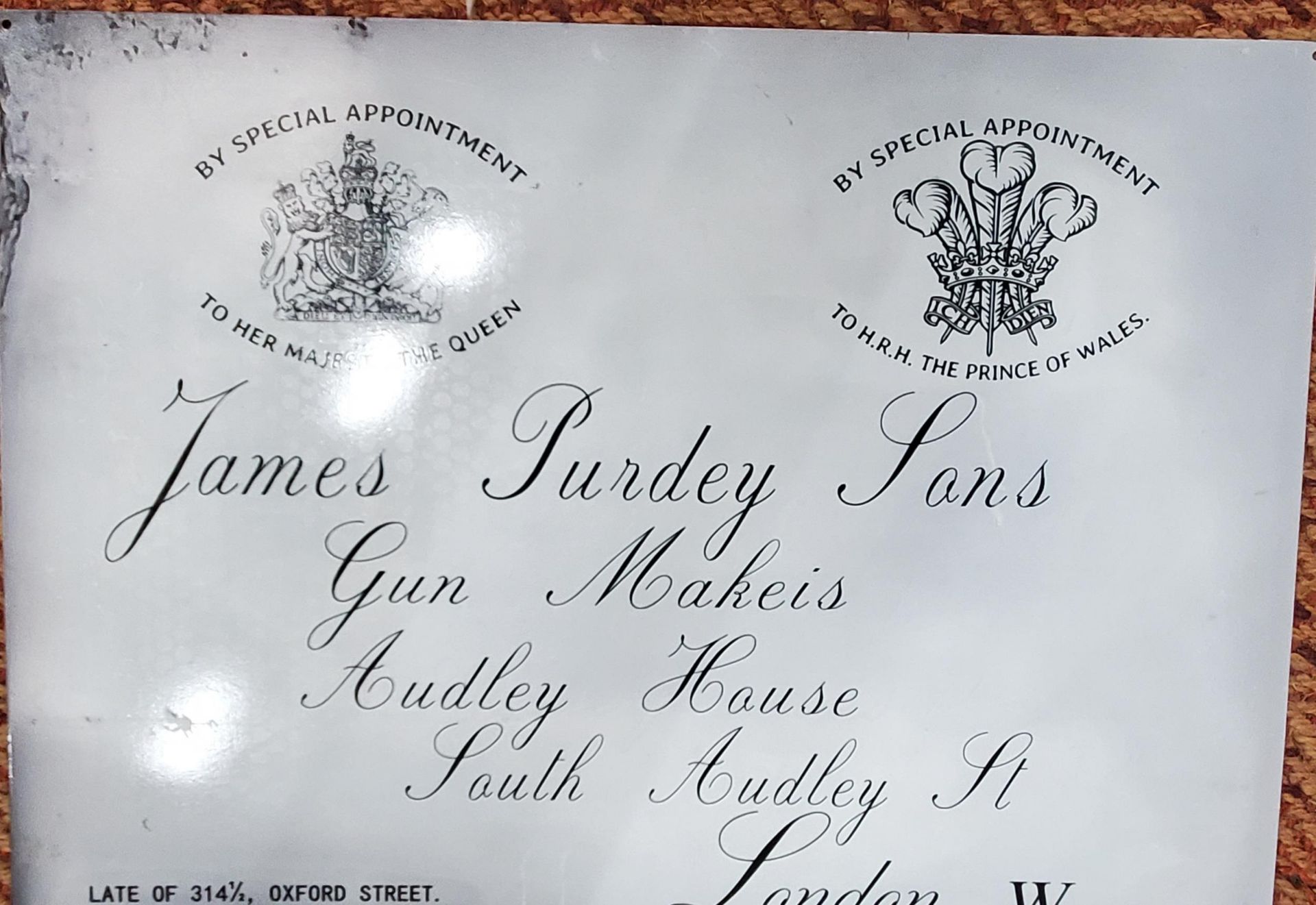 A LARGE METAL 'JAMES PURDEY SONS, GUN MAKERS' SIGN 50CM X 70CM