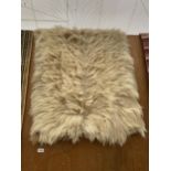 A SHEEP SKIN RUG