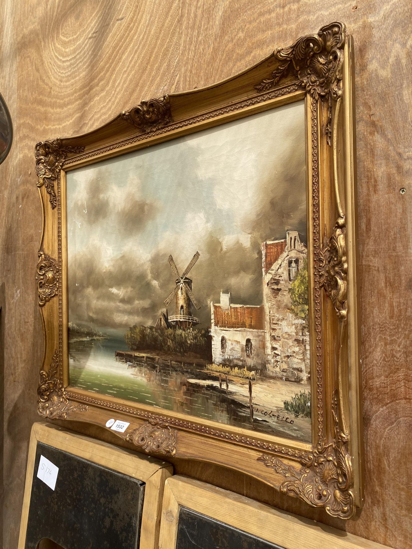 A GILT FRAMED OIL ON CANVAS OF A WINDMILL SCENE, SIGNED I.COSTELLO