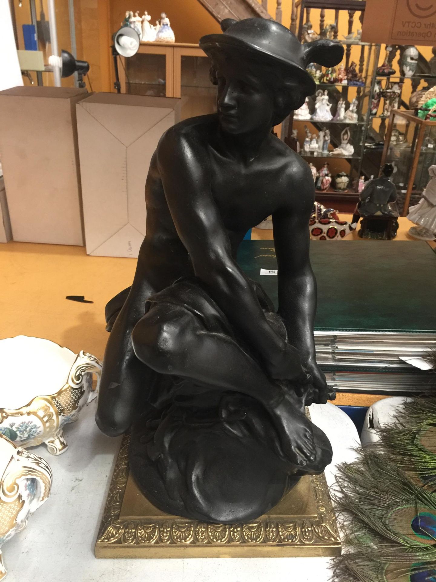 A LARGE RESIN CLASSICAL FIGURE ON BRASS BASE