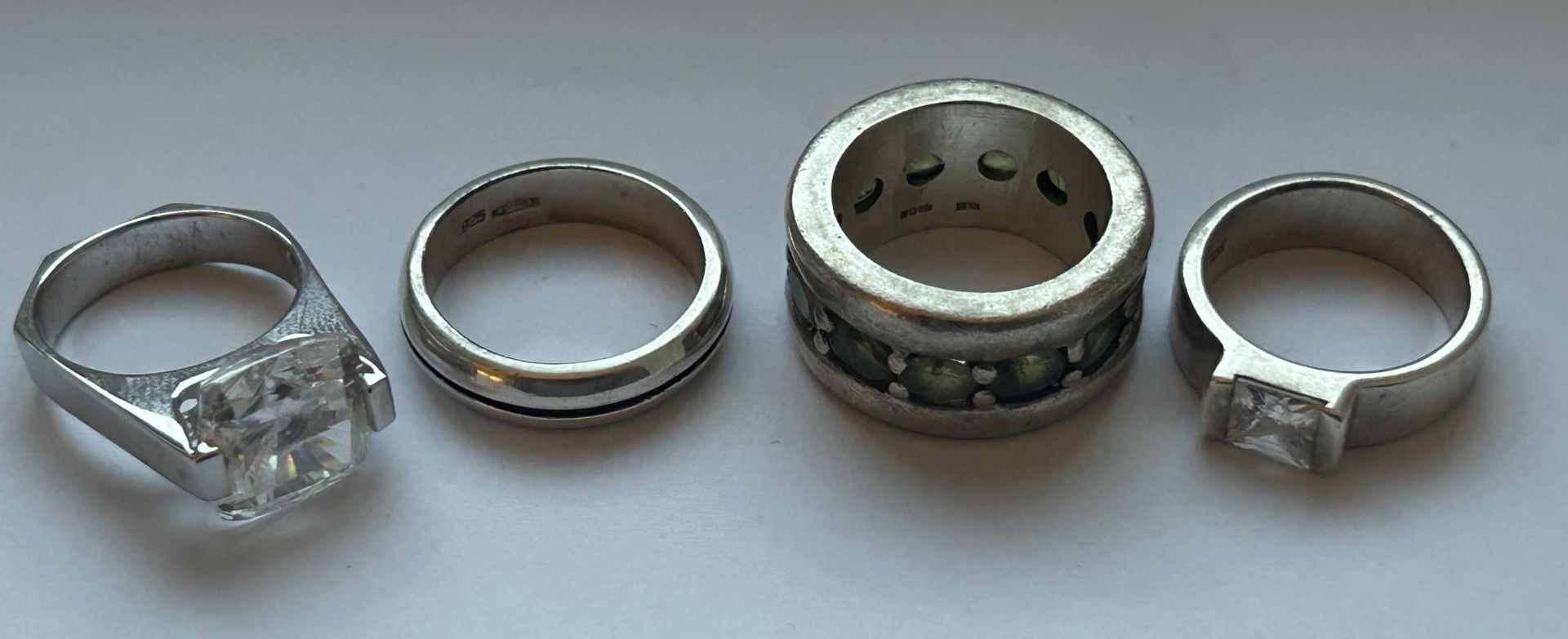 FOUR SILVER DRESS RINGS GROSS WEIGHT 40.46 GRAMS