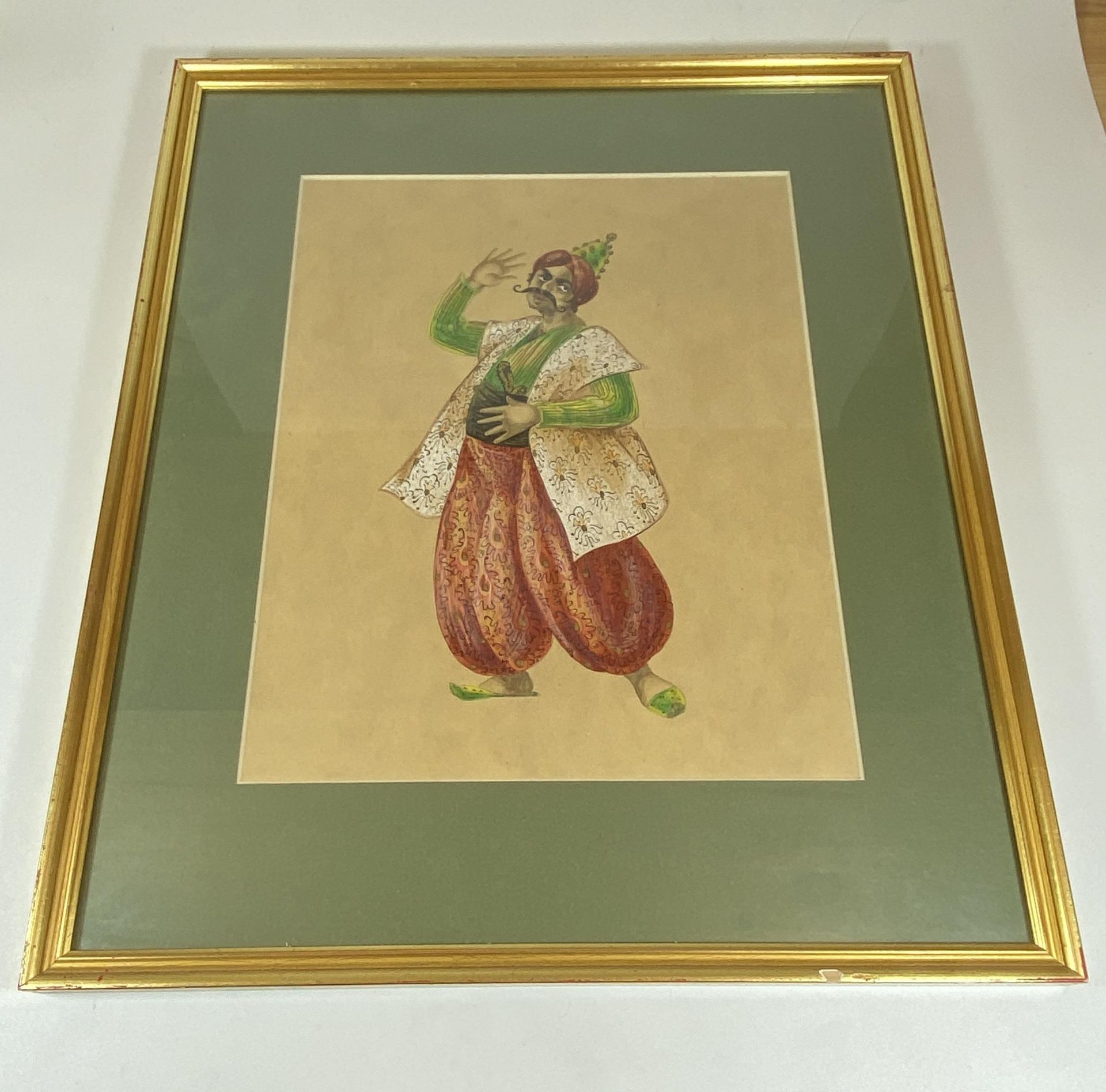 A GILT FRAMED WATERCOLOUR OF A MAN, LABEL TO REVERSE 'MOZART: II SERAGLIO, OSARUN, KEEPER OF THE