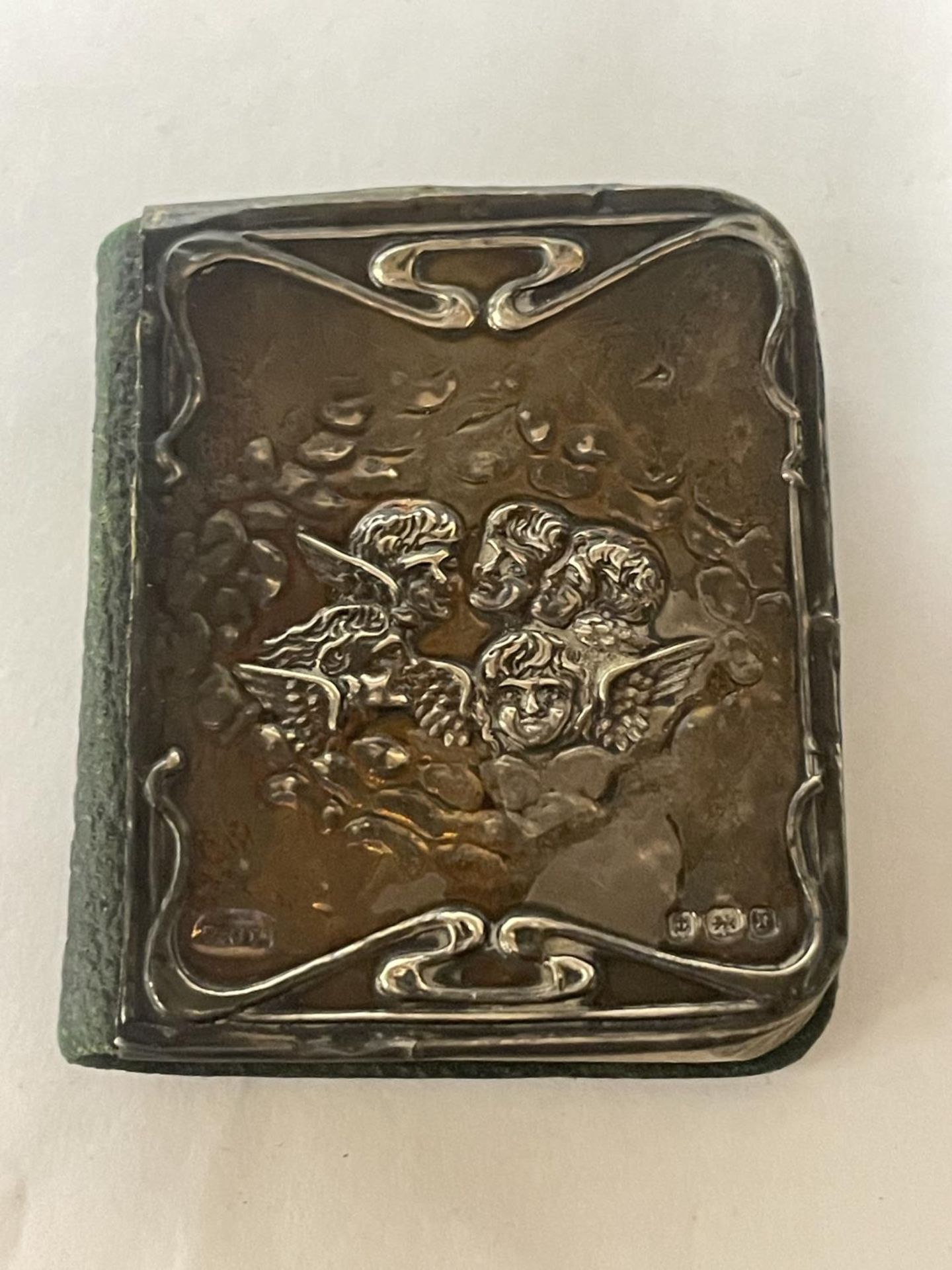 A COMMON PRAYER BOOK WITH A HALLMARKED BIRMINGHAM SILVER FRONT COVER