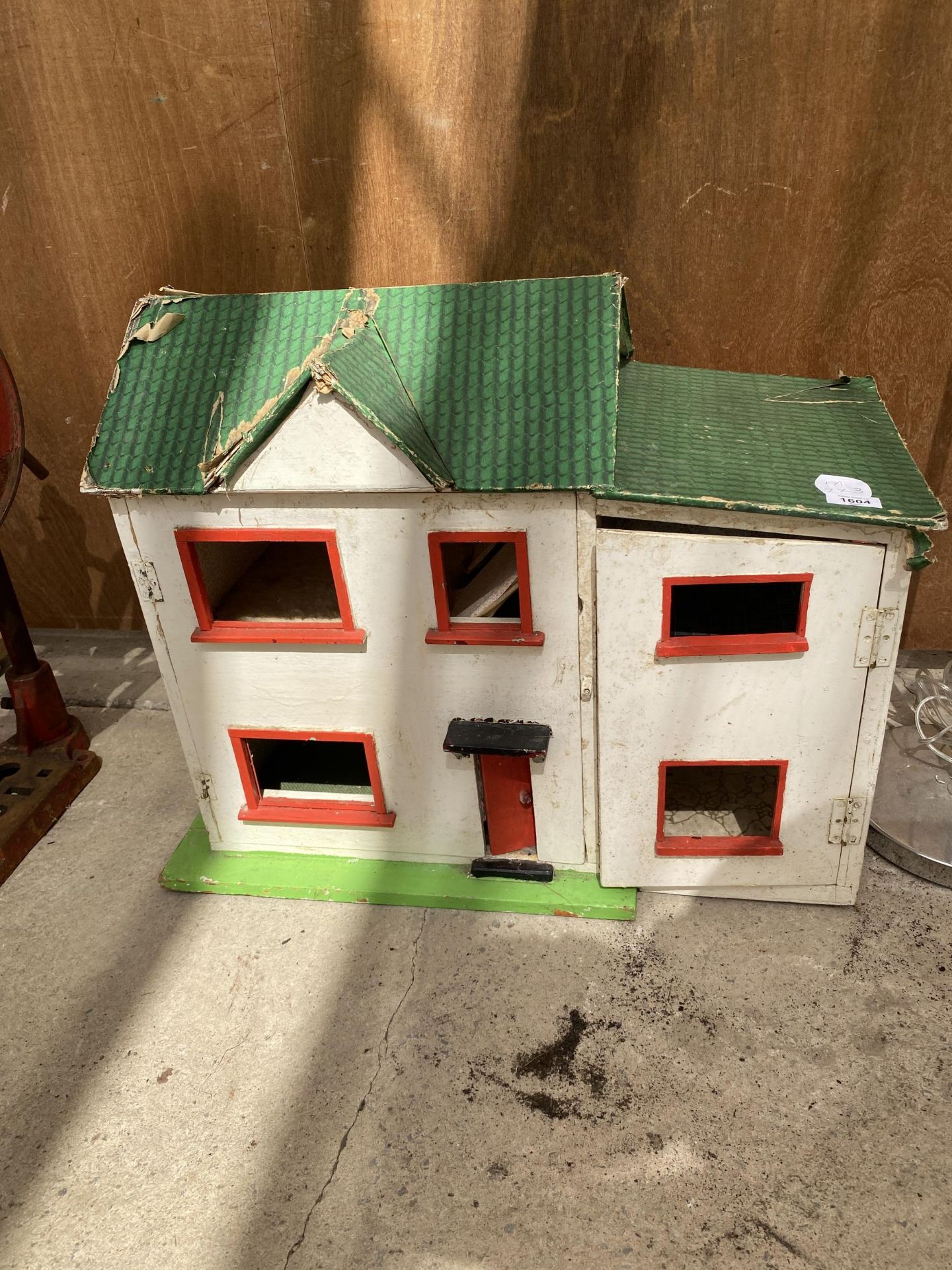 A VINTAGE WOODEN DOLLS HOUSE