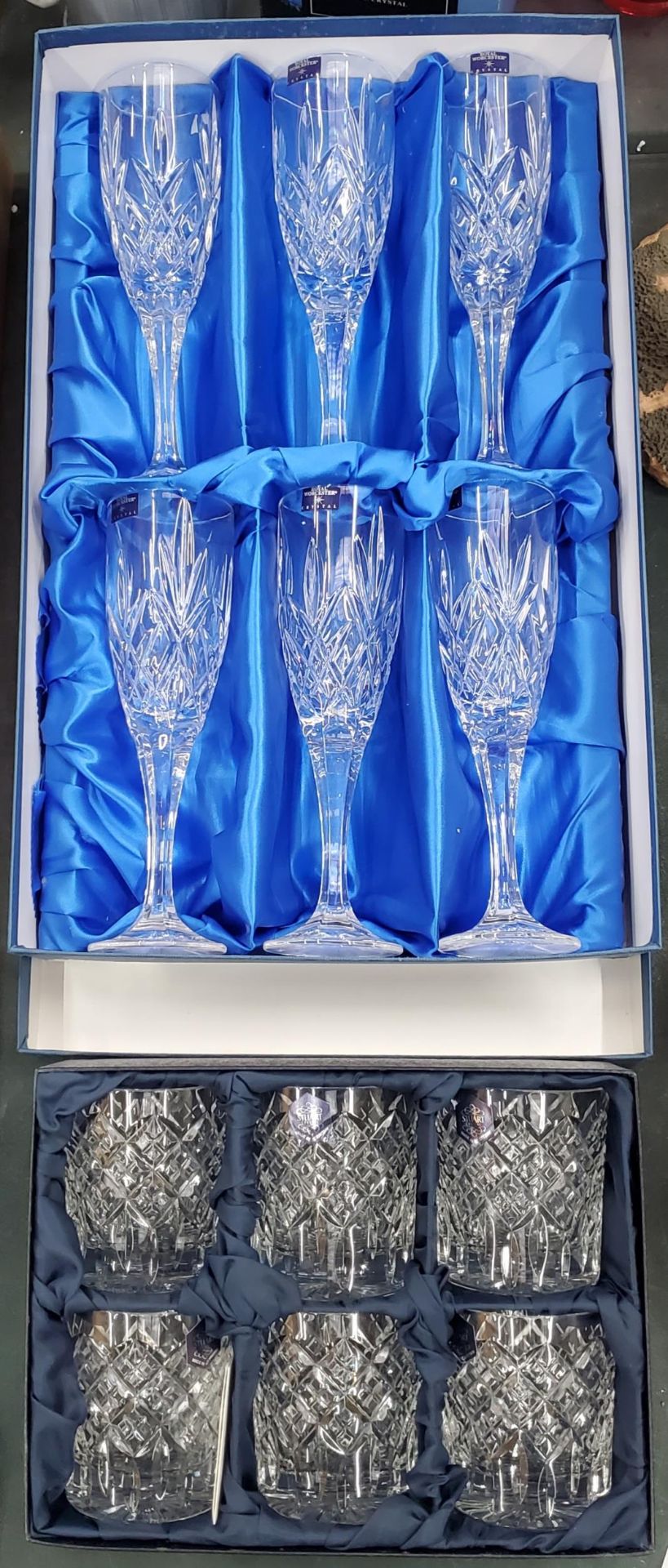 A SET OF SIX ROYAL WORCESTER CHAMPAGNE FLUTES PLUS A BOX OF SIX STUART CRYSTAL WHISKEY TUMBLERS