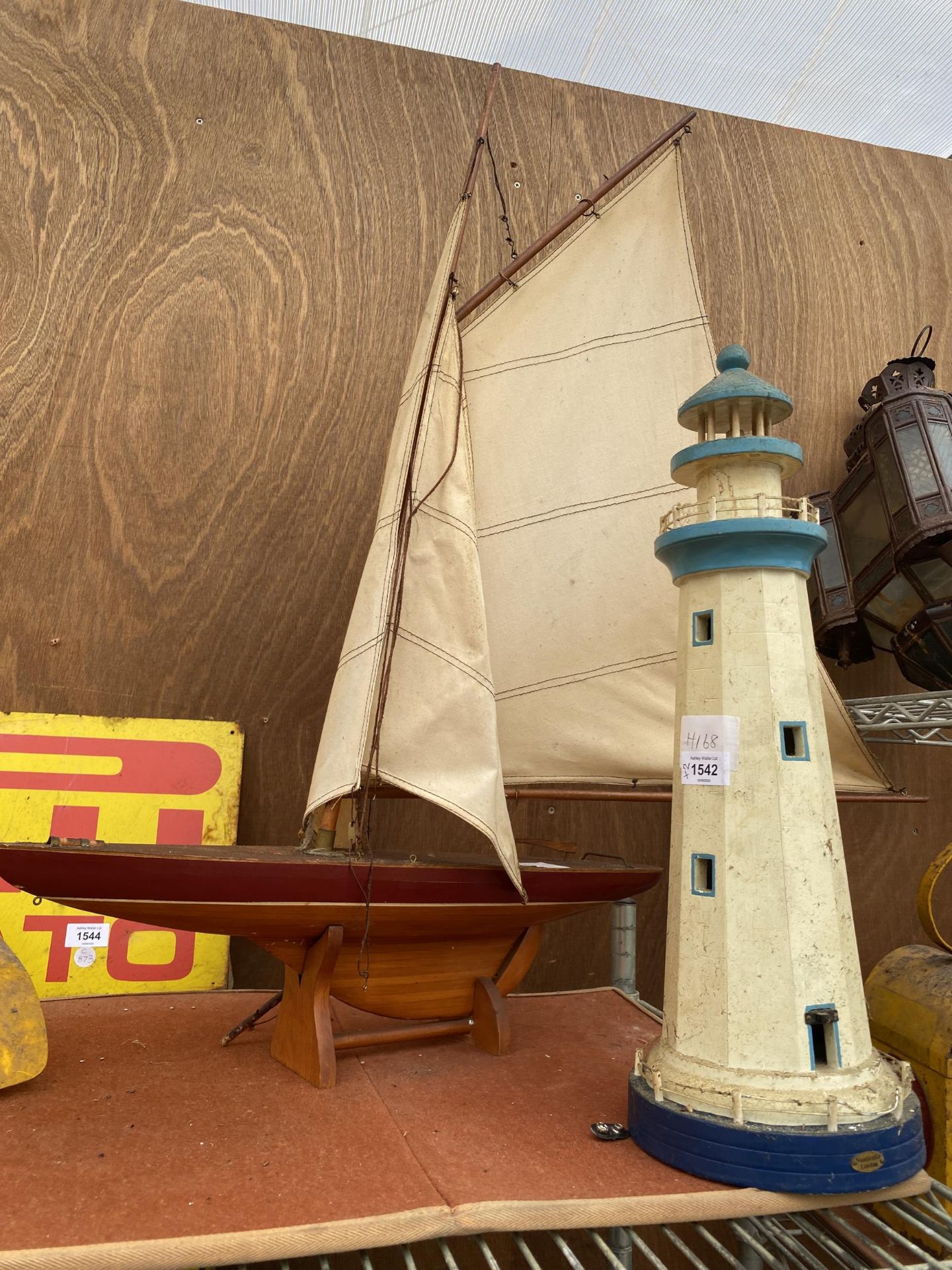 TWO ITEMS - MODEL LIGHTHOUSE AND VINTAGE WOODEN SAILING POND YACHT MODEL
