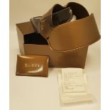 A PAIR OF WRAPAROUND GLASSES MARKED 'VERSACE' IN A GUCCI CASE AND BOX