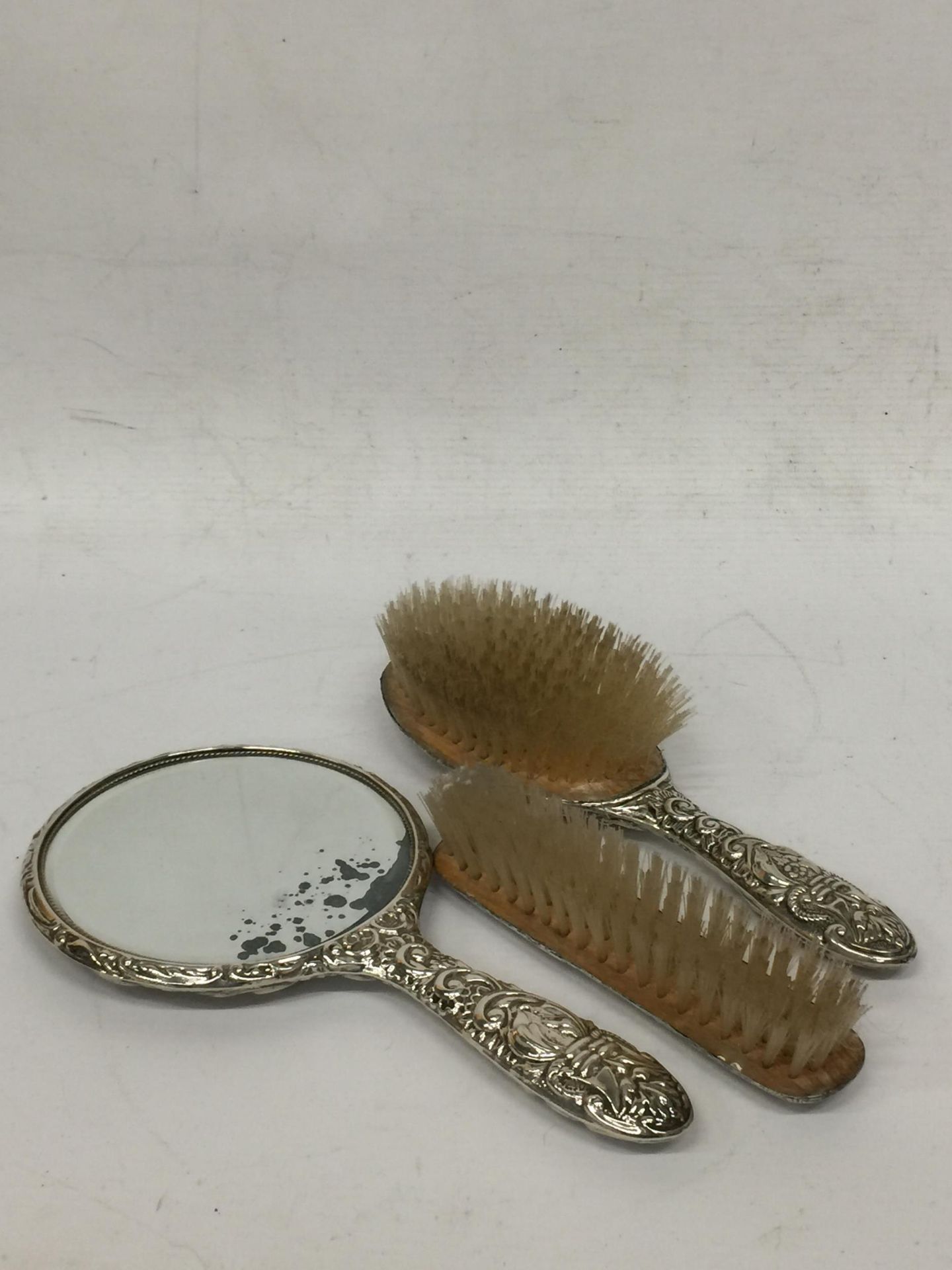 A SET OF THREE HALLMARKED SILVER BACKED DRESSING TABLE ITEMS - TWO BRUSHES AND MIRROR - Image 2 of 2