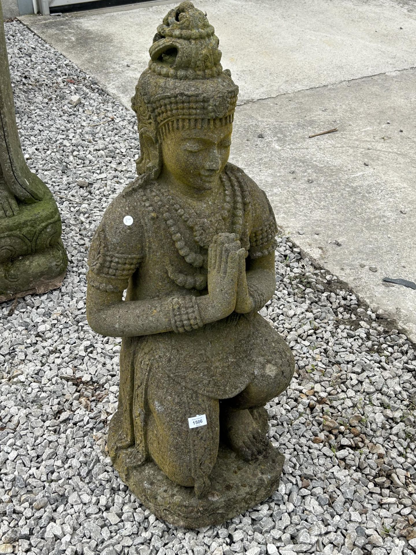 A LARGE RECONSTITUTED STONE BUDDHIST DIETY FIGURE - HEIGHT 108 CM, DEPTH 42 CM