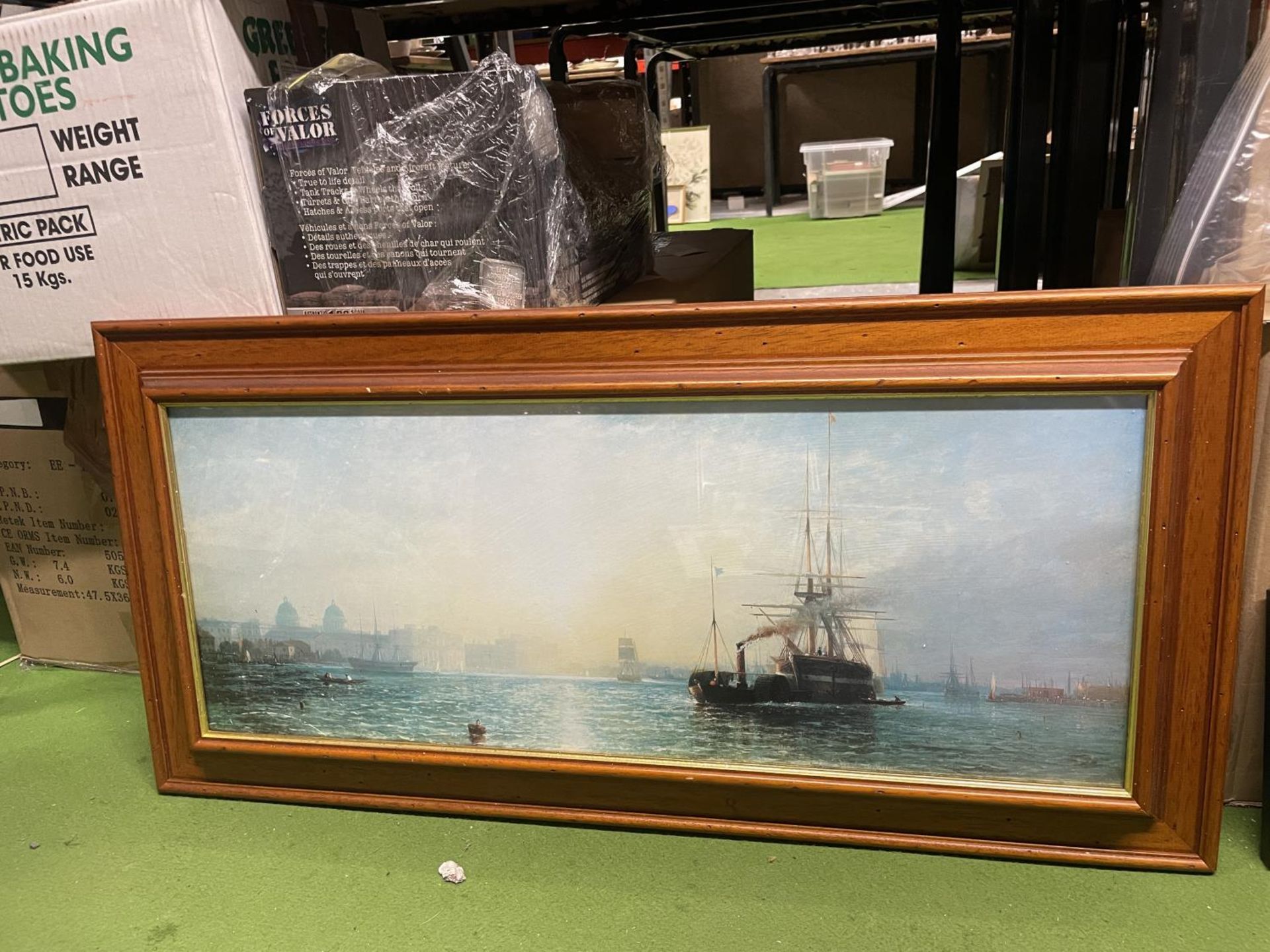 A FRAMED PRINT OF A RIVER SCENE WITH BOATS 39CM X 80CM