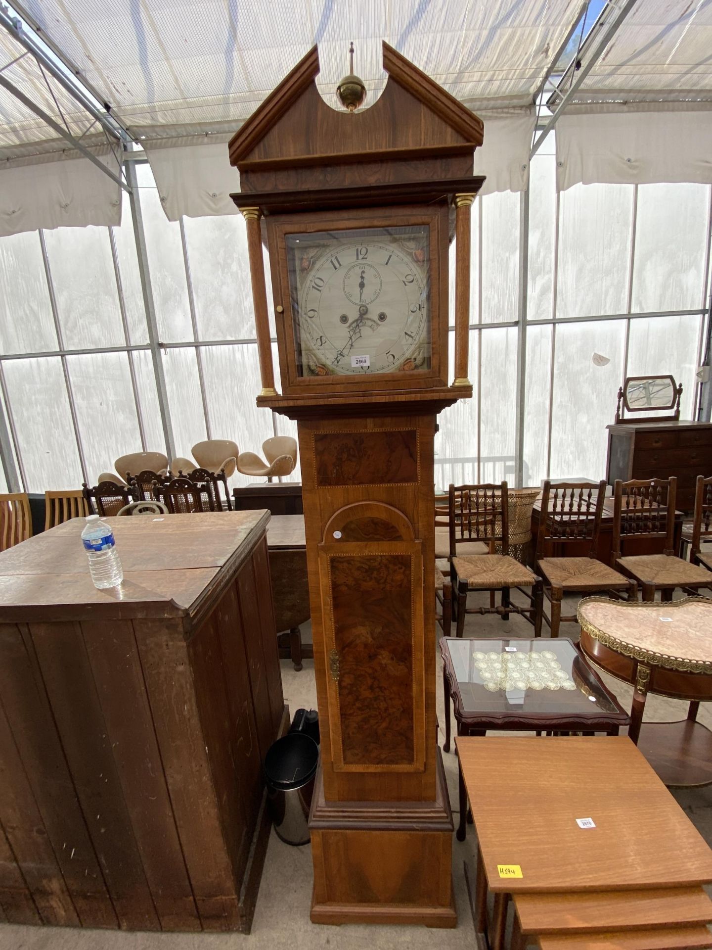 A 19TH CENTURY STYLE WALNUT AND INLAID LONGCASE CLOCK WITH PAINTED DIAL