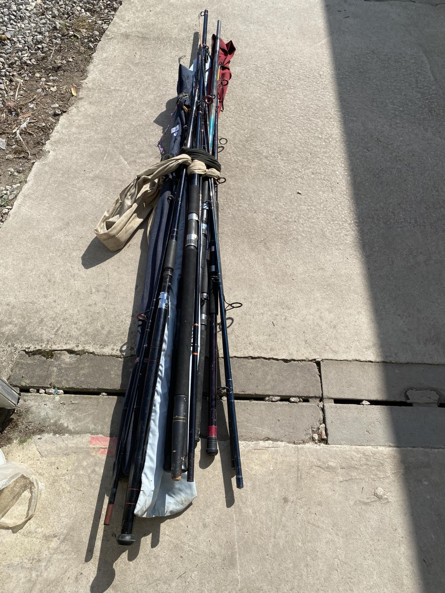 A COLLECTION OF FISHING RODS, SUPERCAST ETC