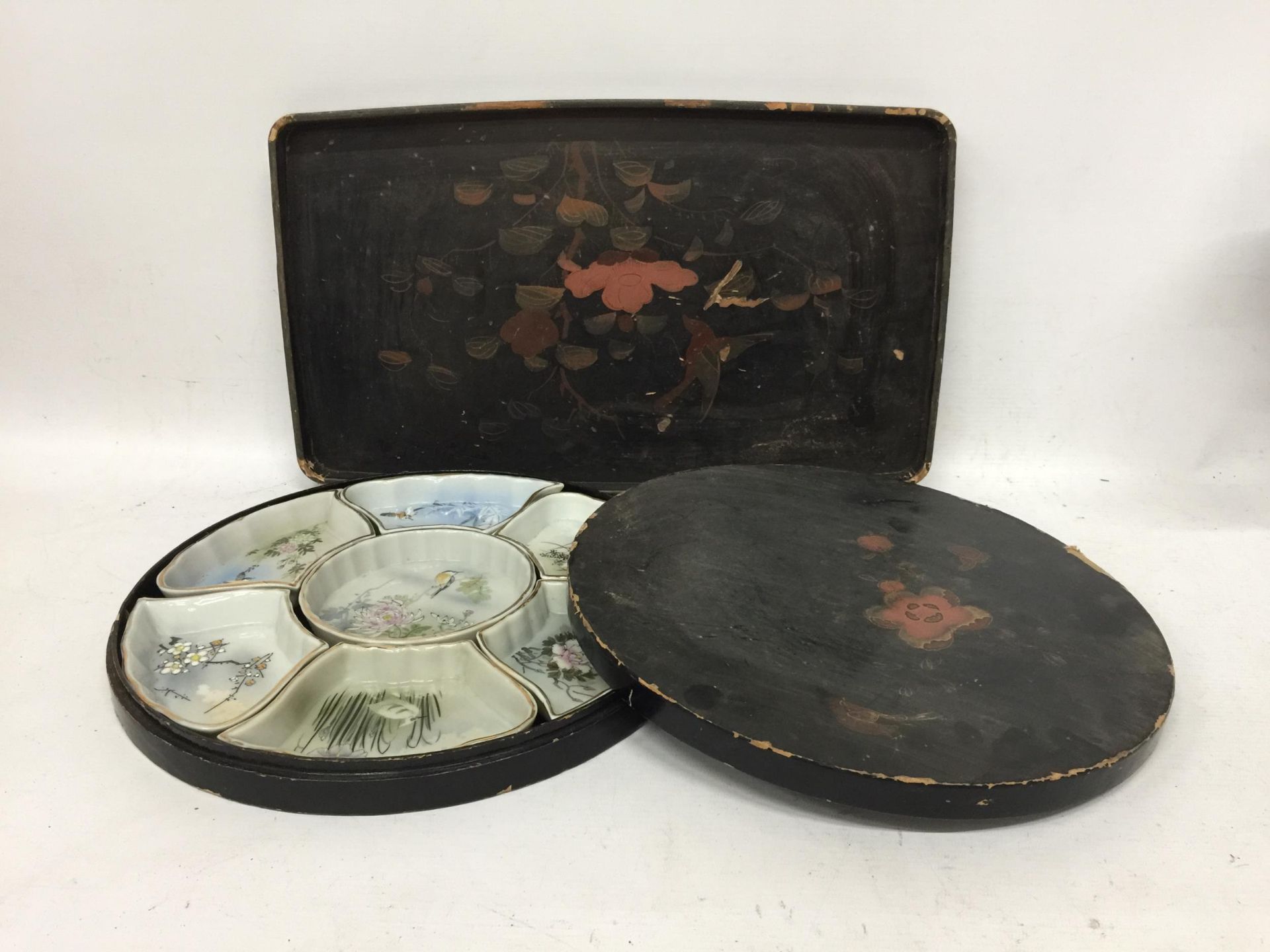 A JAPANESE LACQUERED TRAY WITH CERAMIC HORS D'OUEVRE LIDDED SET