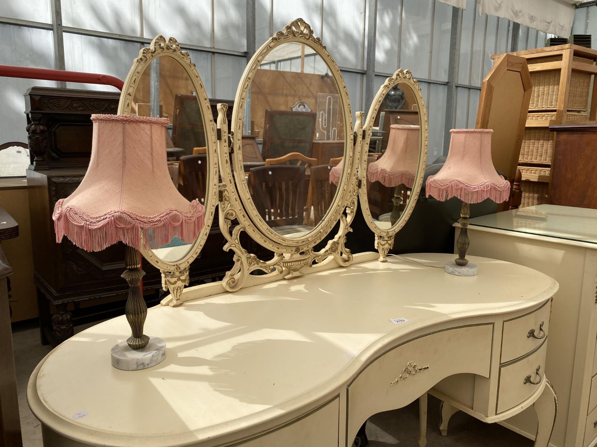 A CREAM AND GILT KIDNEY SHAPED DRESSING TABLE WITH TRIPLE MIRROR AND PAIR OF LAMPS COMPLETE WITH - Image 2 of 3
