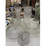 A QUANTITY OF GLASSWARE TO INCLUDE LARGE HEAVY CUT GLASS VASES, BOWLS, A JUG, ETC