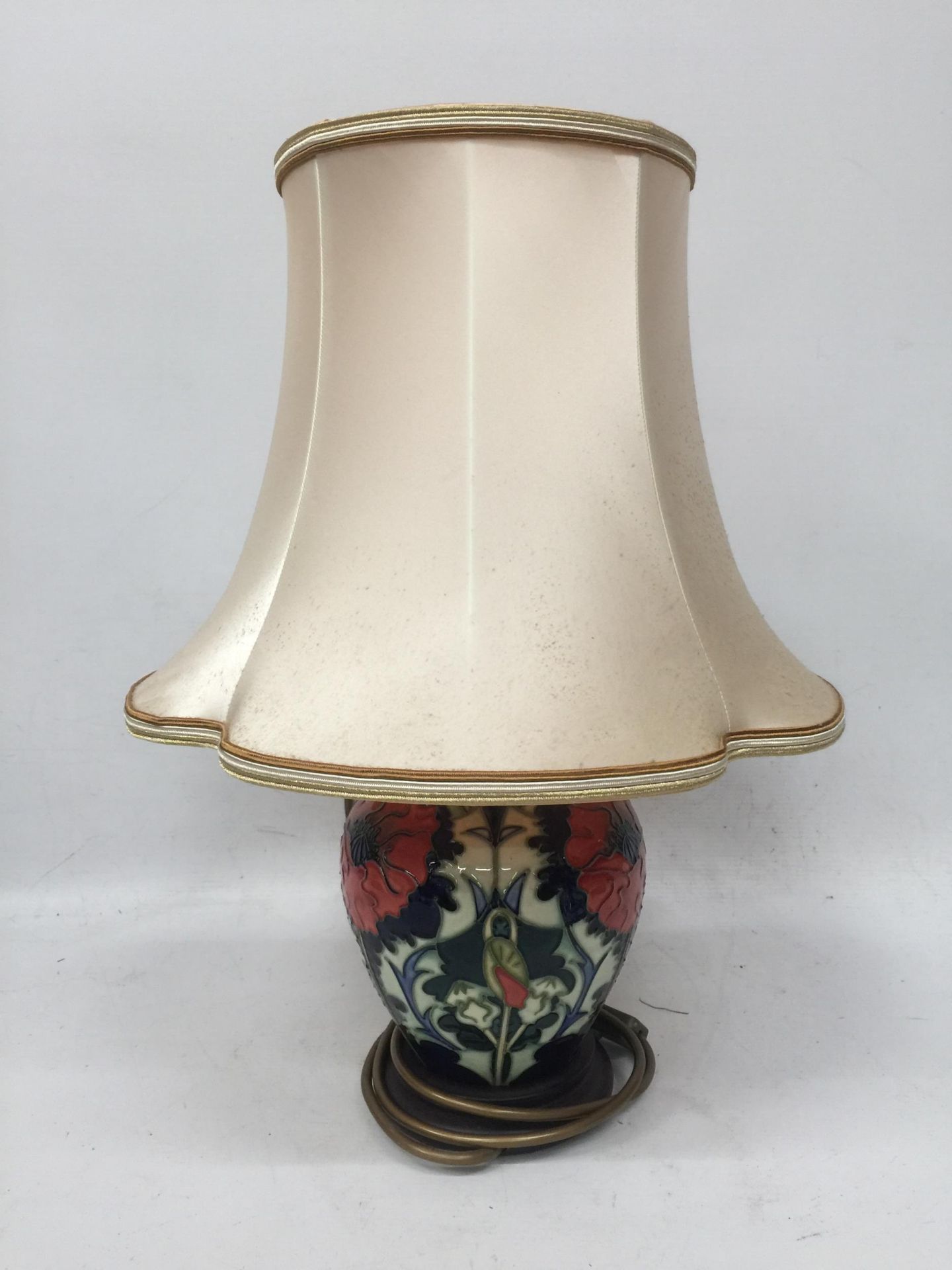 A MOORCROFT POPPY PATTERN TABLE LAMP WITH SILK SHADE