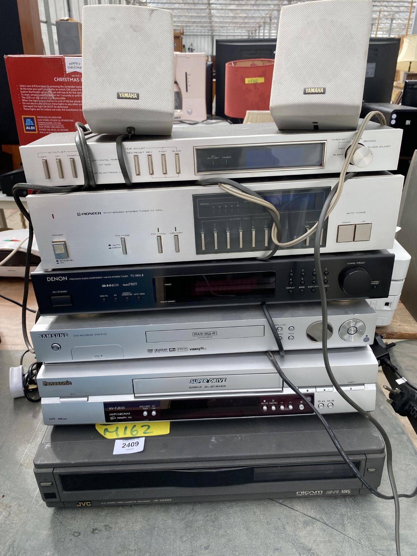 A COLLECTION OF DVD PLAYERS AND SPEAKERS INCLUDING YAMAHA, SAMSUNG, DENON ETC