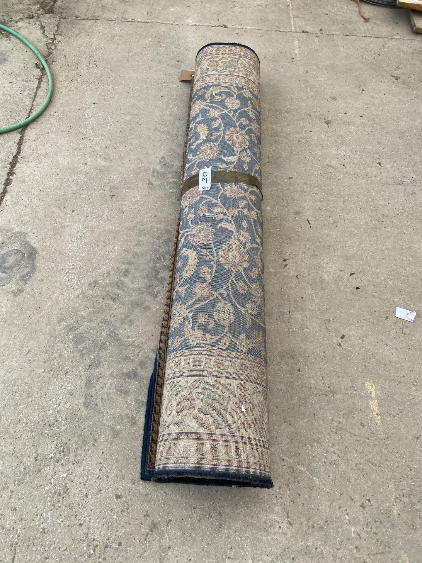 A BLUE AND RED PATTERNED RUG