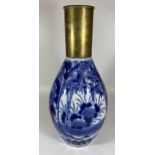 A LARGE JAPANESE MEIJI PERIOD (1868-1912) BLUE AND WHITE FLORAL DESIGN VASE WITH CONVERTED TRENCH