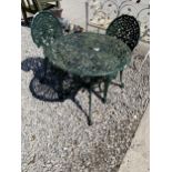 A VINTAGE METAL BISTRO GARDEN TABLE AND TWO CHAIRS