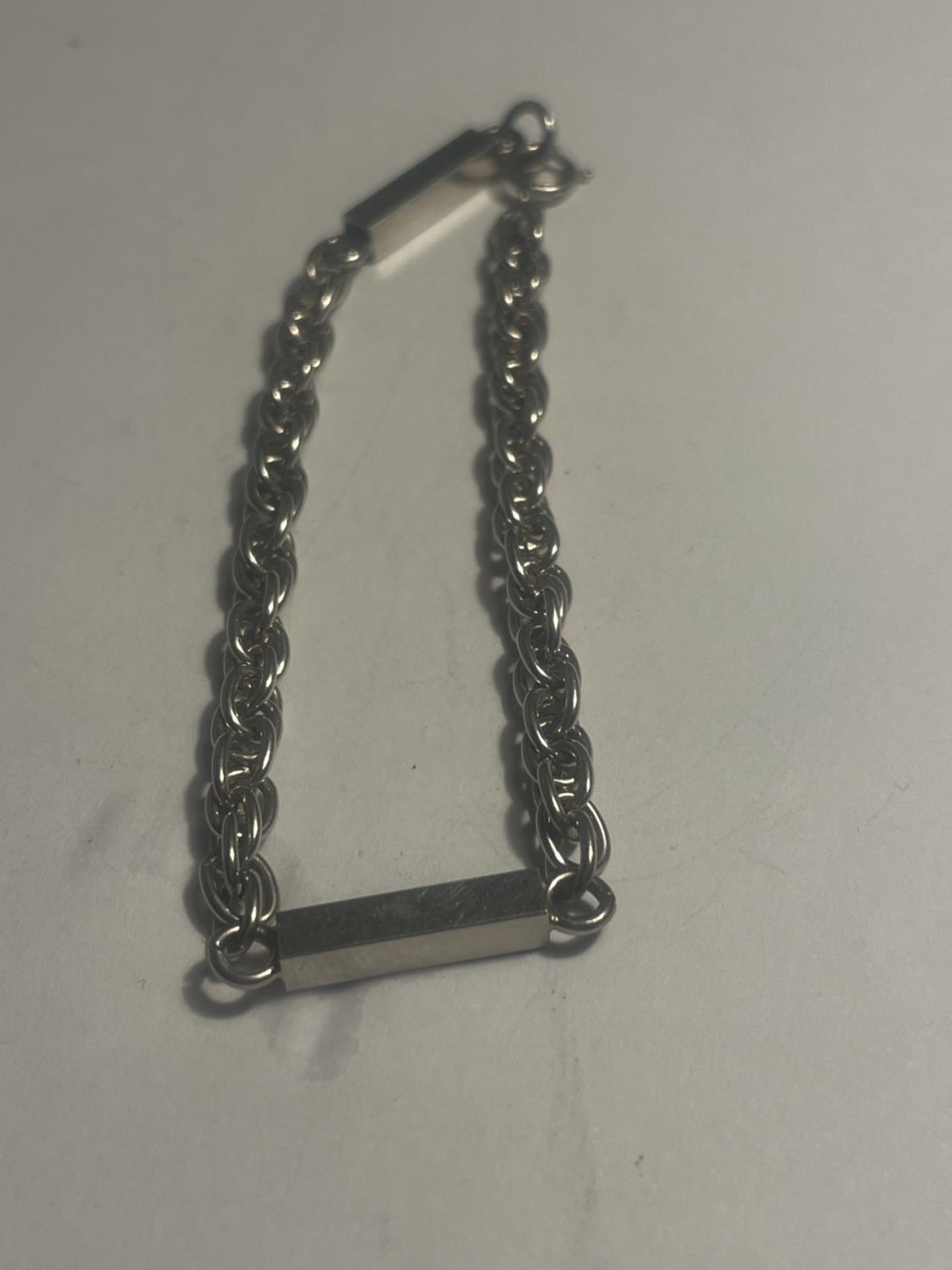 A SILVER BLOCK AND CHAIN BRACELET