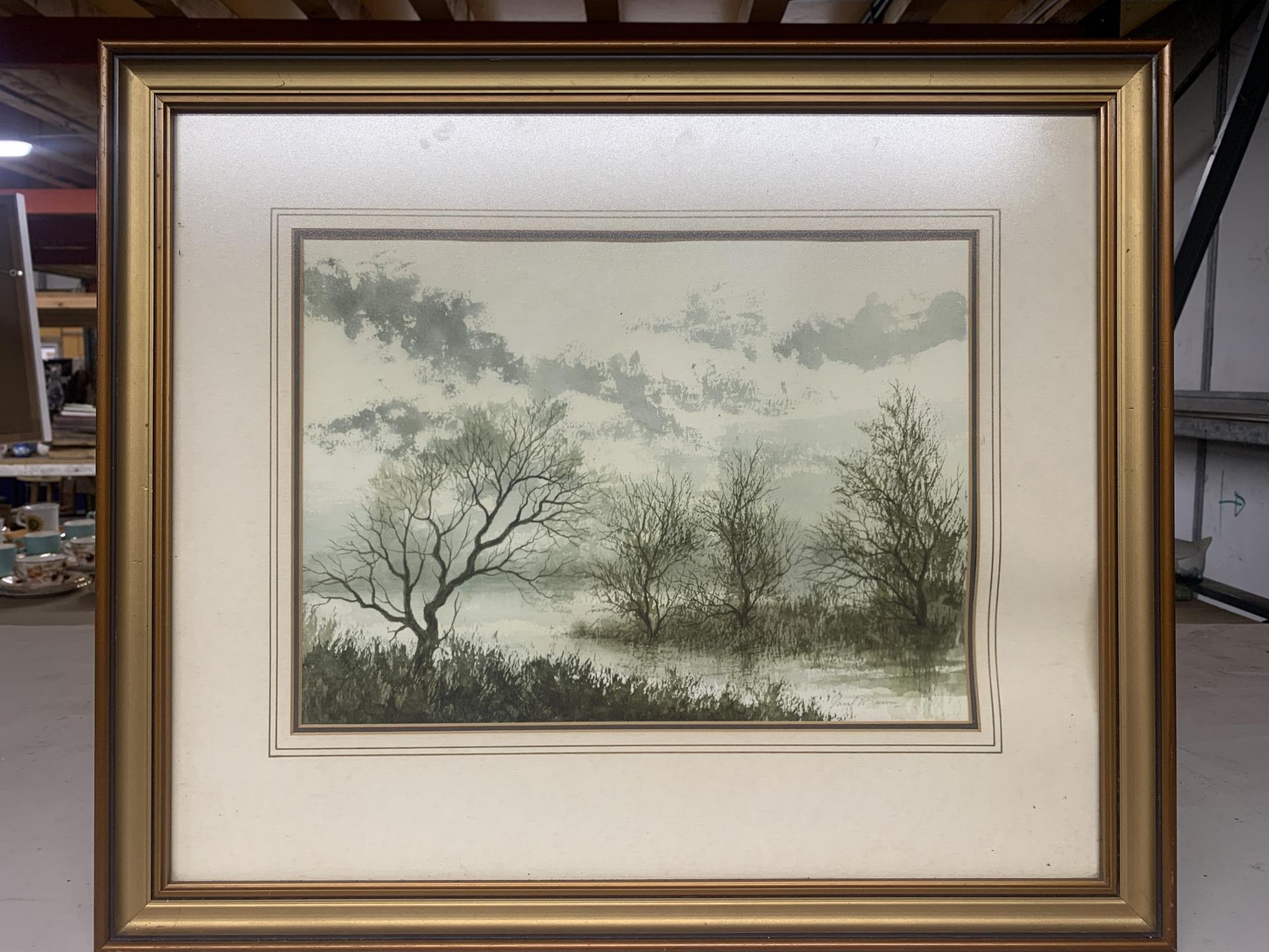 A GILT FRAMED PAUL MANN RIVER SCENE WATERCOLOUR