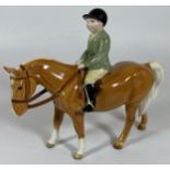 A BESWICK BOY ON PALOMINO PONY, MODEL NO. 1500, (HEAD RE-GLUED) ALSO FRONT LEG ALSO RE-GLUED