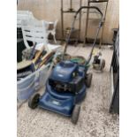 A MACALLISTER PETROL LAWN MOWER (LACKING GRASS BOX)