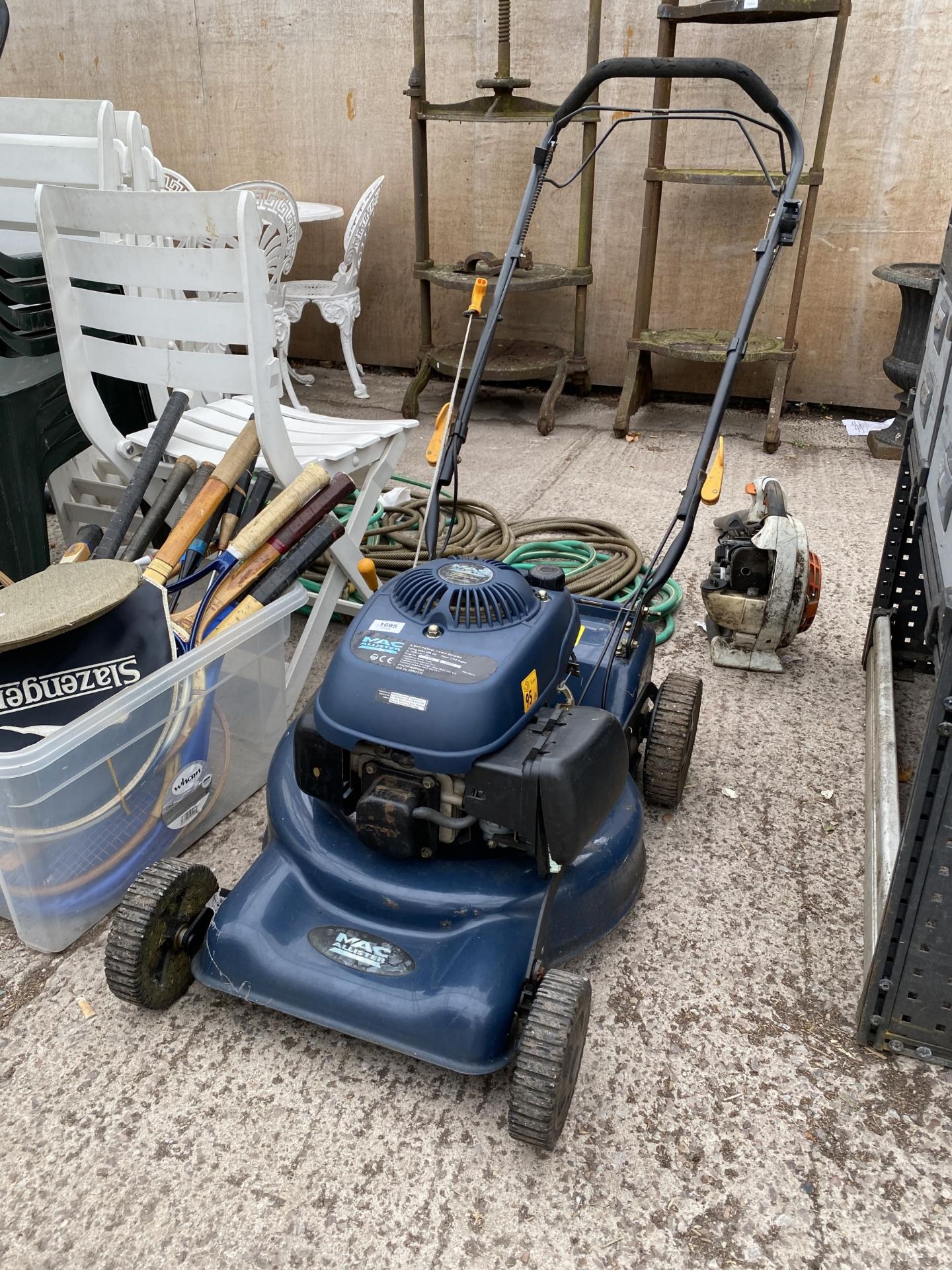 A MACALLISTER PETROL LAWN MOWER (LACKING GRASS BOX)