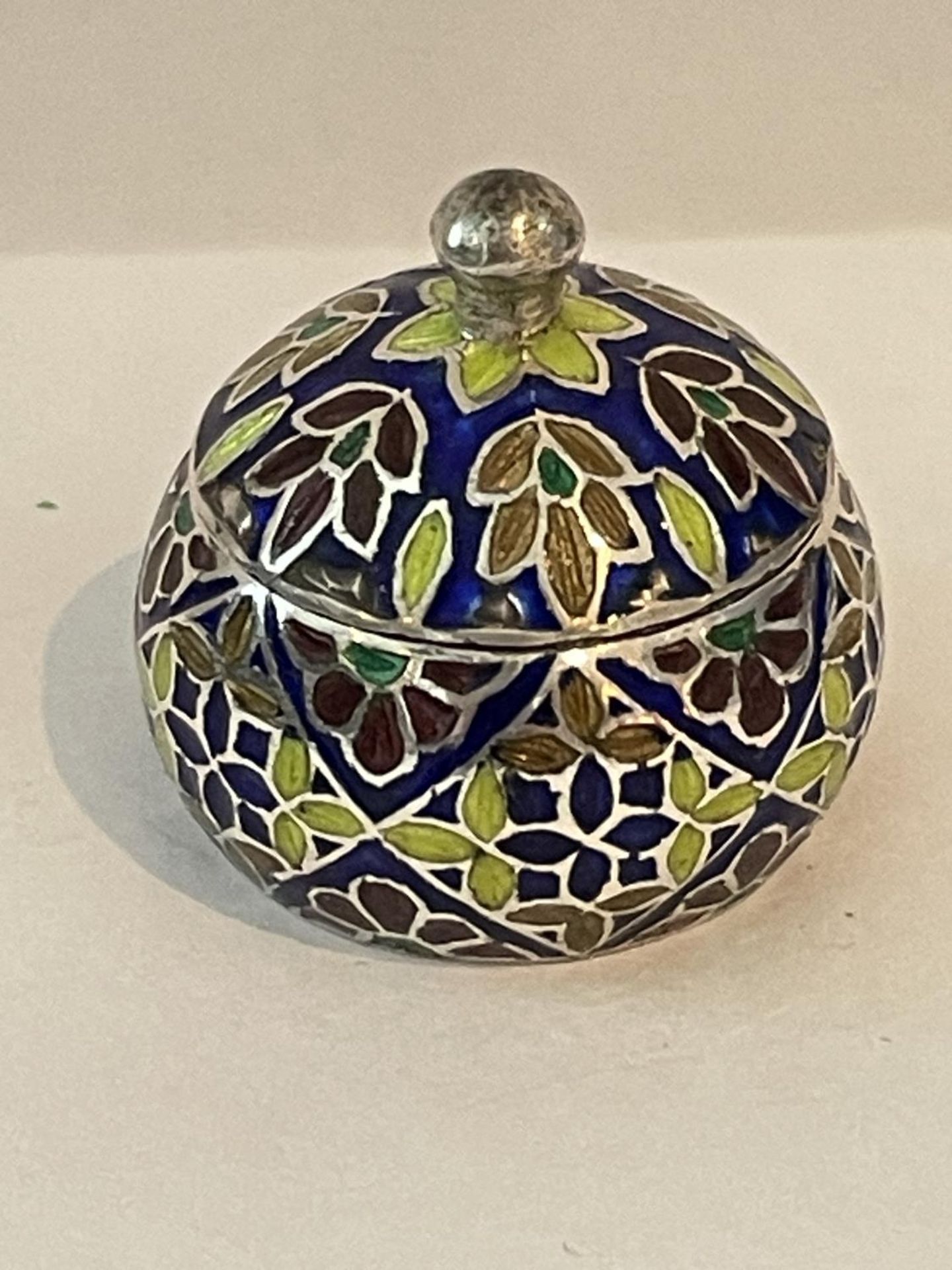 AN ENAMELLED SILVER PILL BOX