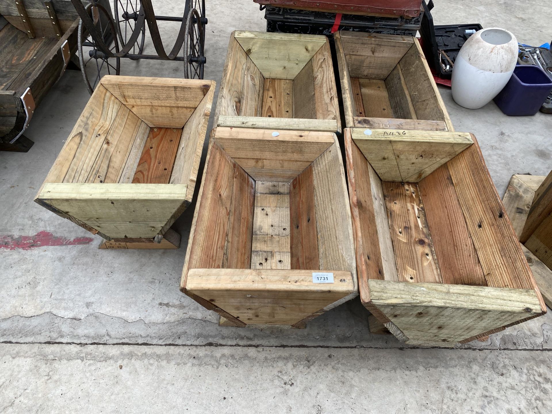 FIVE WOODEN TROUGH PLANTERS