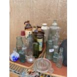 AN ASSORTMENT OF VINTAGE GLASS AND STONEWAR BOTTLES SOME BEARING NAMES