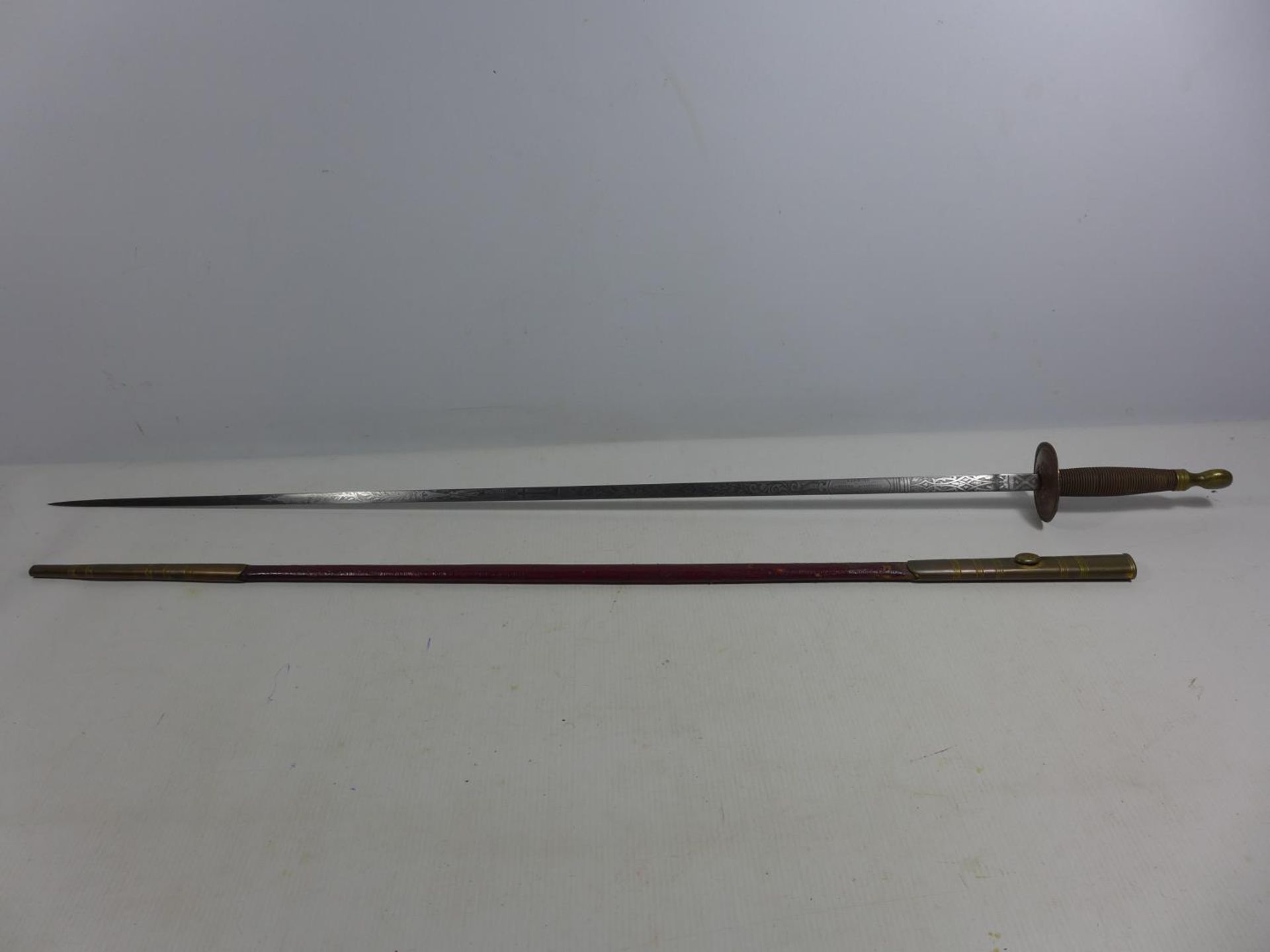 A LATE 19TH EARLY 20TH CENTURY SMALLSWORD AND SCABBARD, 72CM BLADE MARKED KENNING AND WITH MASONIC