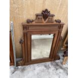 A DECORATIVE MAHOGANY FRAMED OVER MANTLE WALL MIRROR