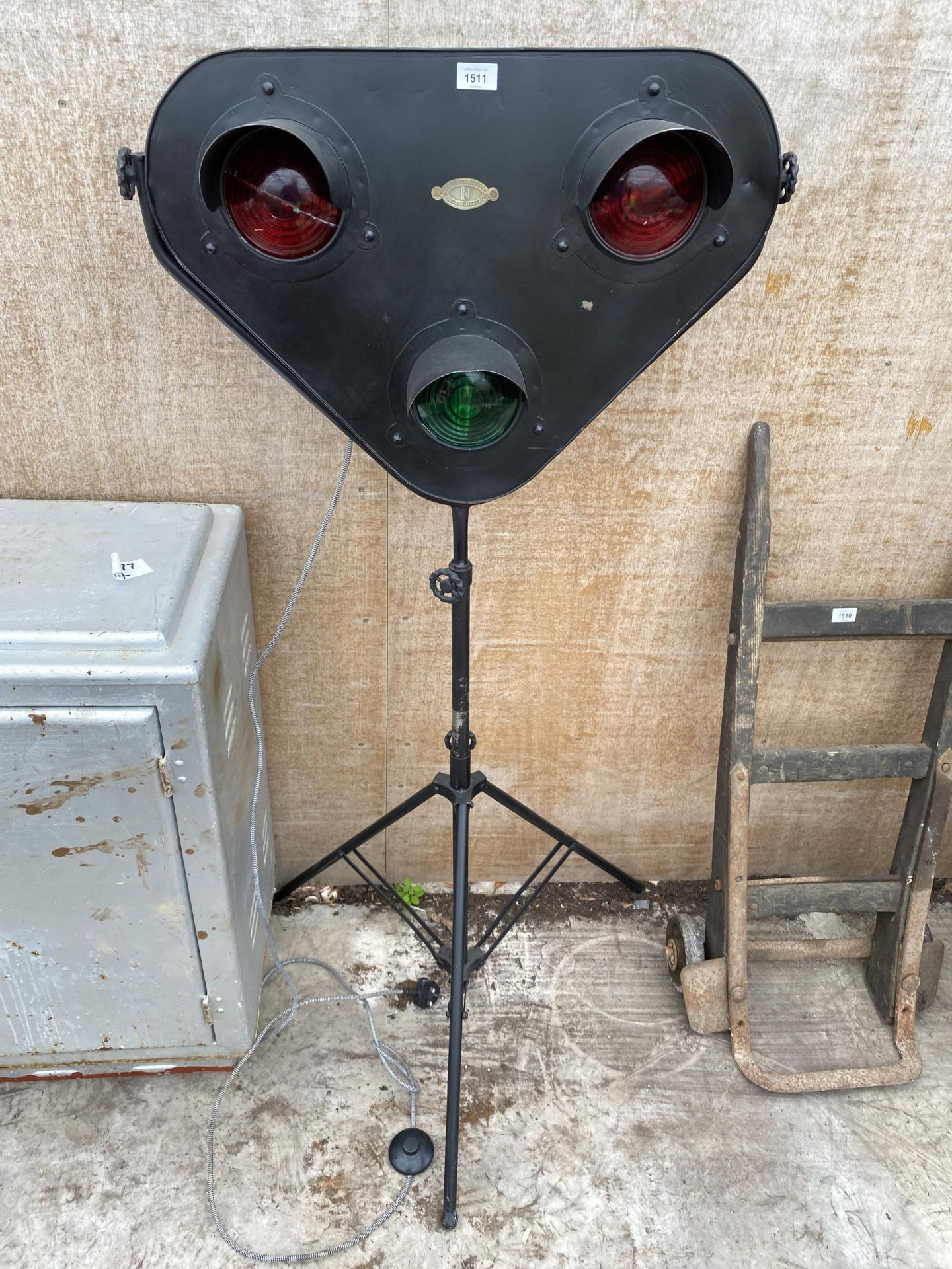 A 'NOBLE LIGHTING COMPANY' TRAIN SIGNAL STYLE LIGHT WITH TRIPOD BASE