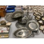A LARGE QUANTITY OF ANTIQUE AND LATER PEWTER TO INCLUDE PLATES, BOWLS, CANDLESTICKS, ETC