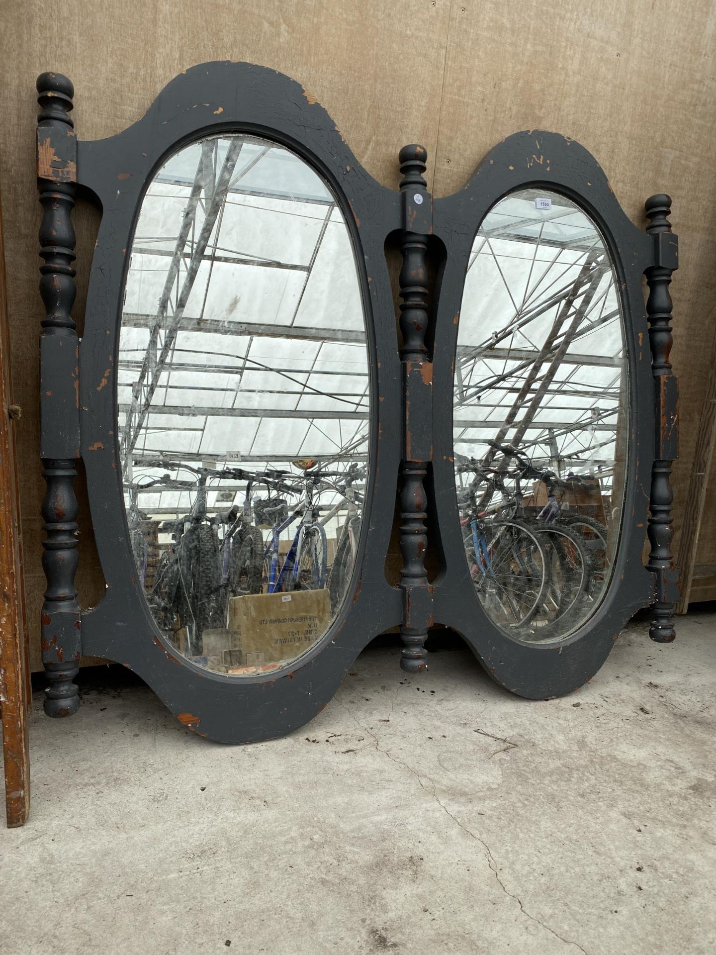 A VINTAGE WOODEN DOUBLE OVAL WALL MIRROR
