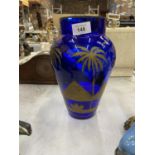 A BLUE GLASS VASE DECORATED WITH A GILT PYRAMIDS SCENE, HEIGHT 26CM