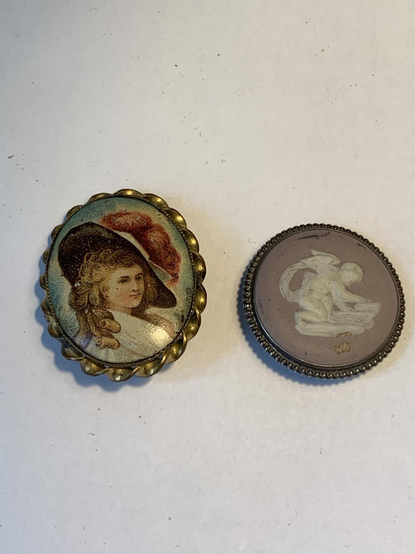 TWO BROOCHES TO INCLUDE A PURPLE WEDGWOOD JASPERWARE