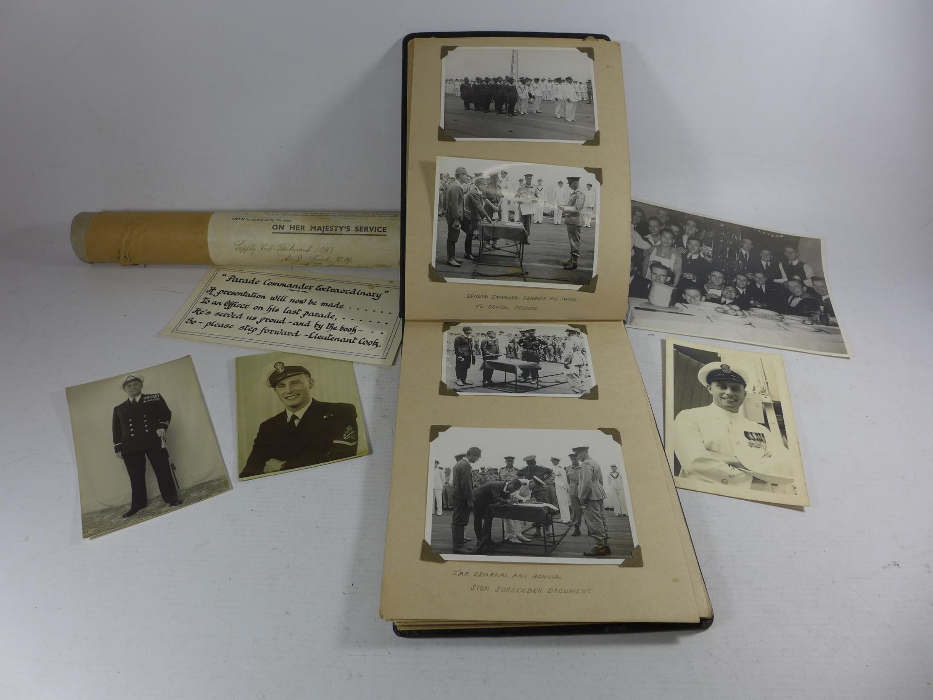 A WORLD WAR II PHOTOGRAPH ALBUM CONTAINING PHOTOGRAPHS OF THE JAPANESE SIGNING OF THE INSTRUMENT