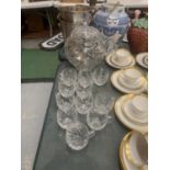 A HEAVY CUT GLASS PUNCH BOWL WITH LID, PUNCH GLASSES AND A STAMPED WMF SILVER PLATED LADEL WITH