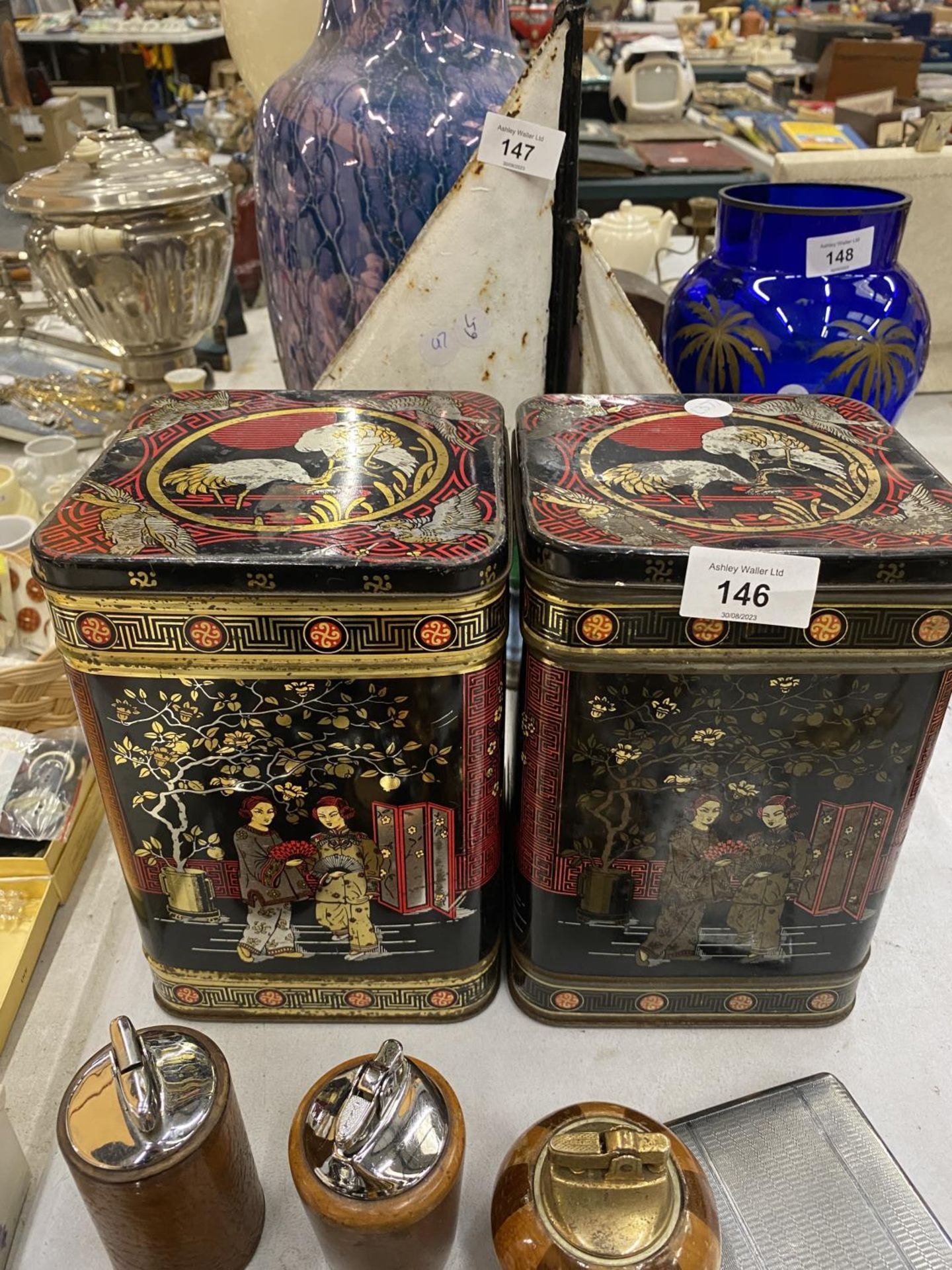 TWO VINTAGE TIN TEA CADDYS WITH ORIENTAL DESIGN