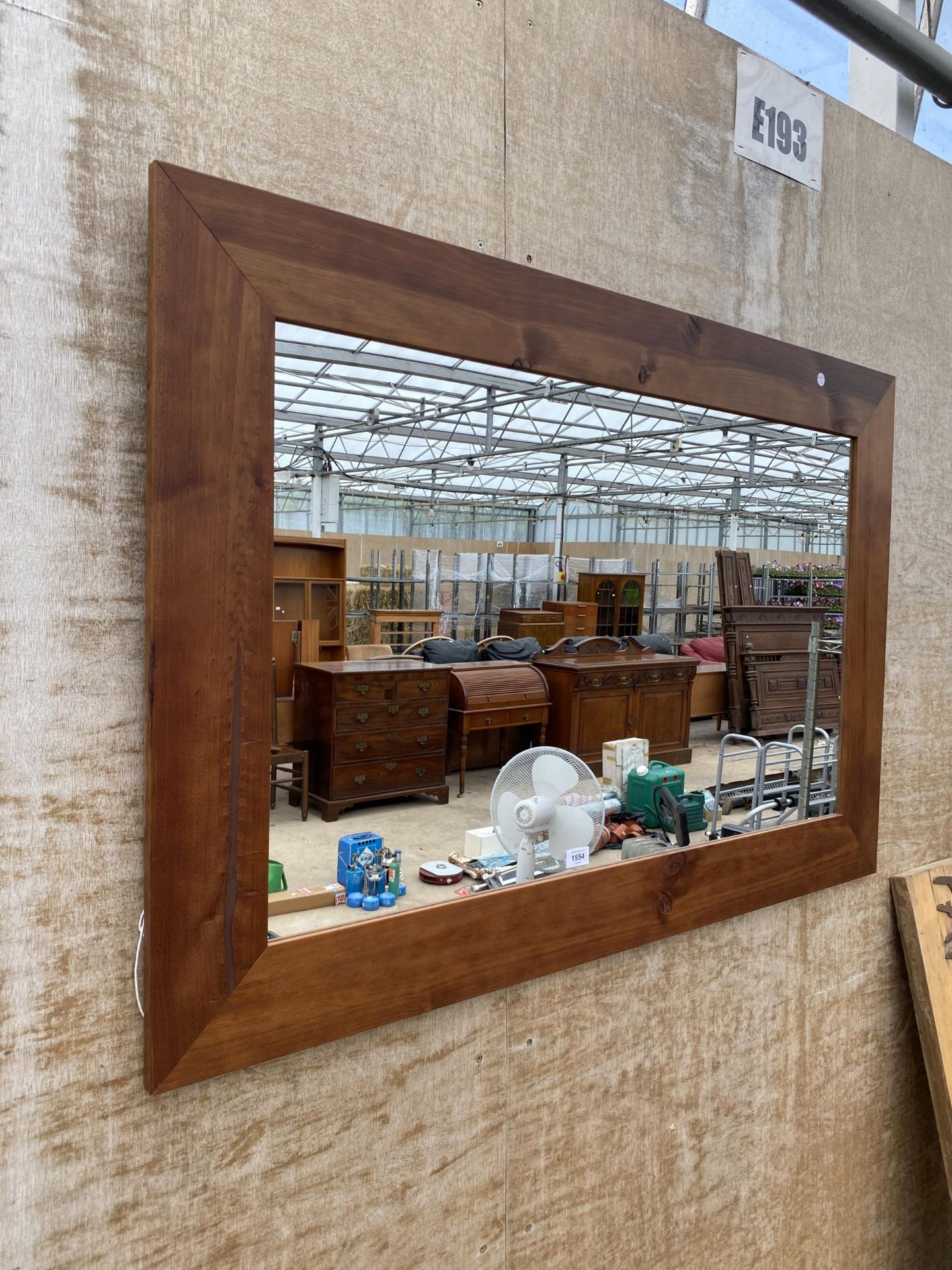 A LARGE PINE FRAMED WALL MIRROR