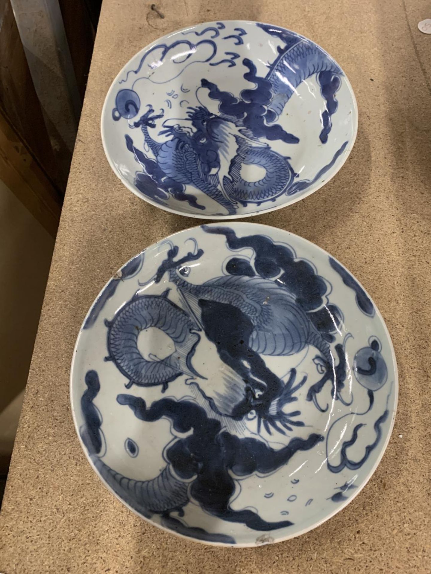 TWO VINTAGE BLUE AND WHITE CHINESE BOWLS WITH DRAGON DESIGN