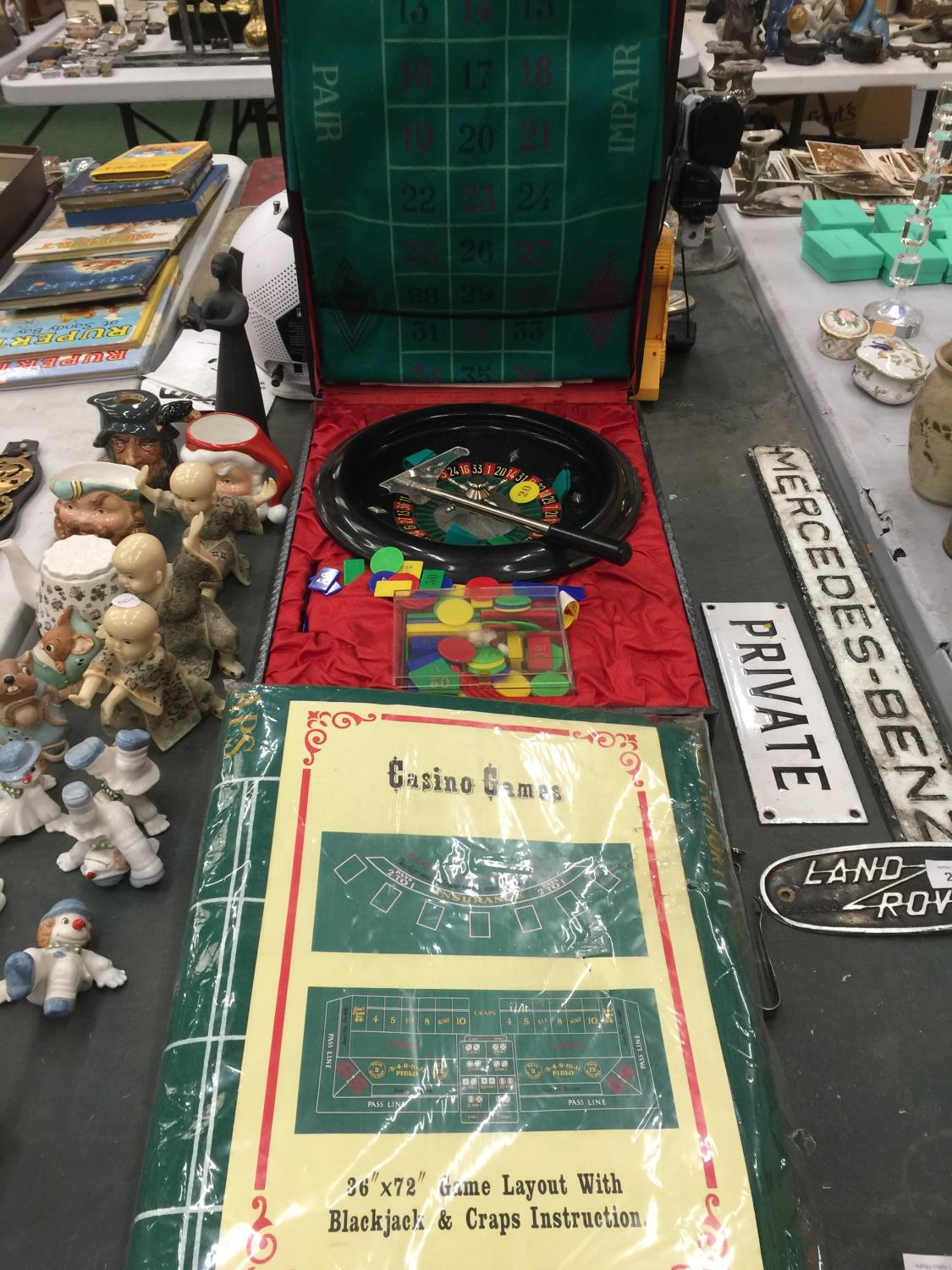 A CASED ROULETTE SET WITH WHEEL, COUNTERS, FELT MAT, ETC